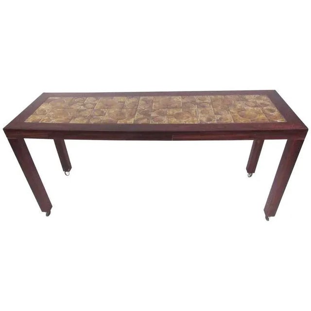 This stylish vintage console table features rosewood construction and unique tile inlaid top. Two dovetailed drawers...