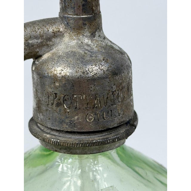 A beautiful green glass soda water bottle, a true piece of 1930s Italian bistro style. An excellent addition.