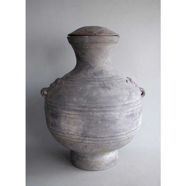 This large and imposing jar, of "hu" form, was made over two thousand years ago during the Western Han Dynasty (206 BC -...
