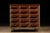 Vintage rolling wooden parts cabinet. This piece features 12 drawers of uniform size, plus an additional three smaller...