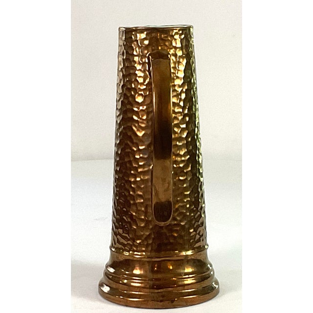 1930s Handcrafted, Artisan – Ceramic Large, Pitcher, and Eight Tankards-in a Hammered Copper Lusterware Finish - Set of 9 For Sale - Image 11 of 11