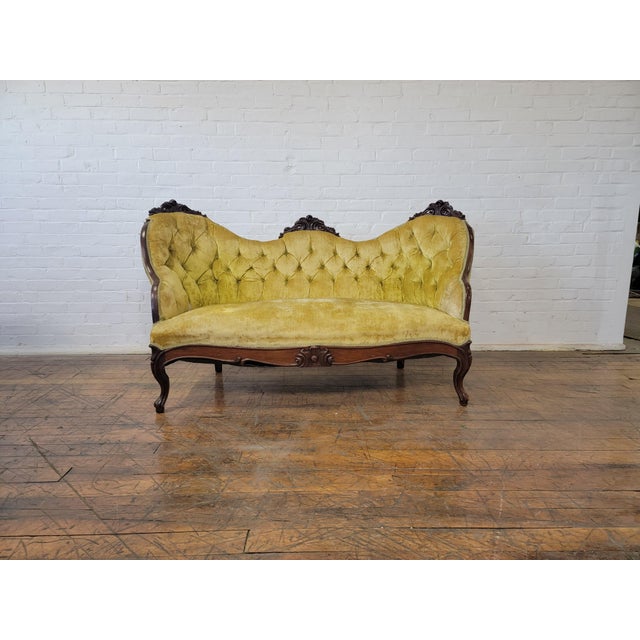 Antique Yellow Loveseat With Carved Wood and Tufted Yellow Velvet