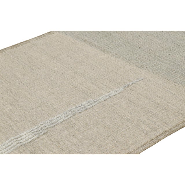Made with handwoven wool and jute, this 5x8 contemporary flatweave rug by Rug & Kilim enjoys geometric patterns in beige-...