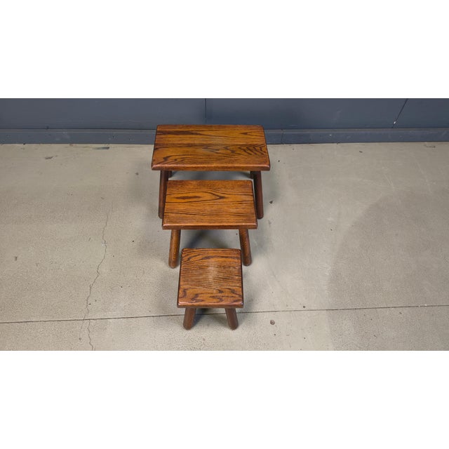 Lovely set of brutalist oak nesting tables. Primitive and robuste design. 1960s - Belgium Good condition Dimensions of the...