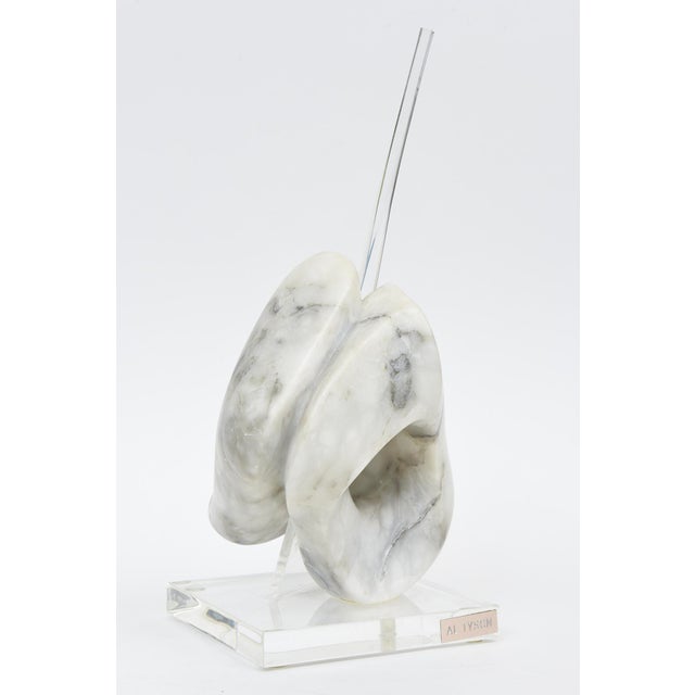 This wonderful vintage marble and lucite sculpture changes forms with all directions. It is signed Al Tyson.with a plague...