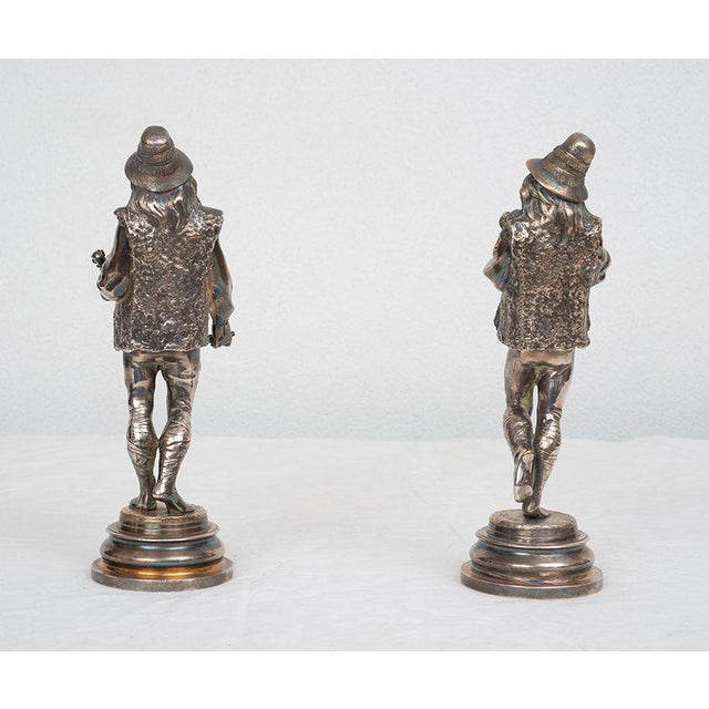Pair of antique silver-plated bronze sculptures depicting two musicians, signed "Lalouette" (1826-1883). The two...