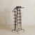 A French valet from the 1950s by Jacques Adnet reflects a refined approach to utility, where structure, material, and...