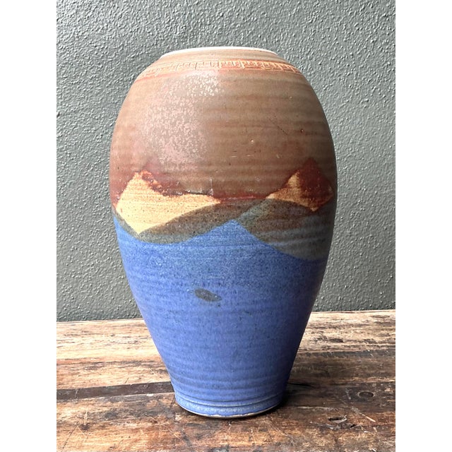 This exceptional studio pottery vase is a stunning example of late 20th-century ceramic art, featuring a masterfully...
