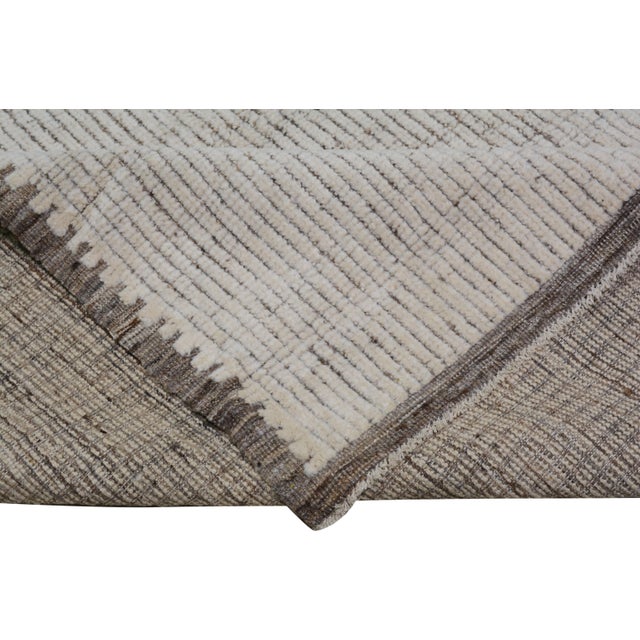 Hand-knotted with care using traditional rug-making techniques, this wool rug blends timeless craftsmanship with a modern...