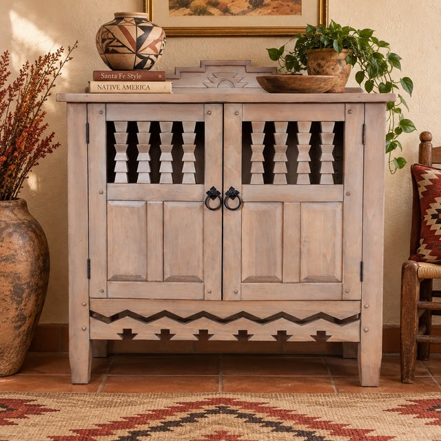 Handsome Ernest Thompson Southwest-style cabinet featuring the substantial handcrafted character and architectural...