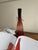 A tall bottle-form vase designed by Jerzy Słuczan-Orkusz for the Tarnowiec glassworks in southern Poland. In the Polish...