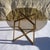Dining table featuring a smoked glass top on a bronze anodized aluminum frame. A light and elegant piece. The frame is...