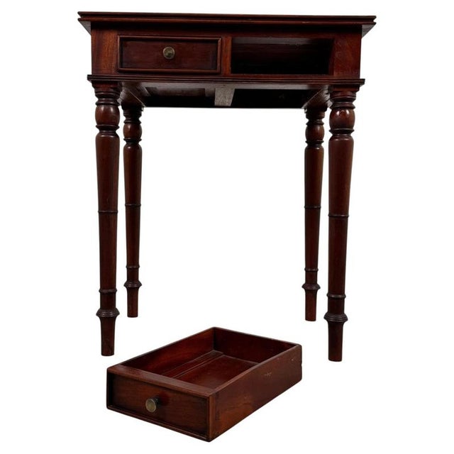 A charming early 20th-century English side table, finely crafted from mahogany and distinguished by its compact...