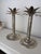 Set of palm tree-shaped candle holders for a vintage decor. Beautiful silver patina