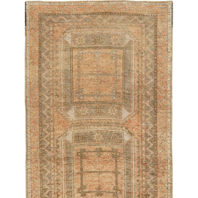 This mid-20th-century Turkish Anatolian runner presents four large, vertically aligned octagonal medallions arranged...