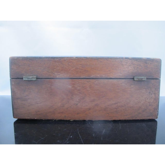 Antique, Victorian era, wood tea caddy or trinket box. Rectangular box with inlaid mother of pearl at top of lid and at...