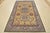 This traditional tribal geometric Caucasian Kazak rug is hand-knotted with an all-wool pile on a cotton foundation. This...