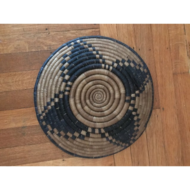 Beautiful round hand-made African woven basket blue and brown. Decorative and functional. Good condition. Acquired at an...