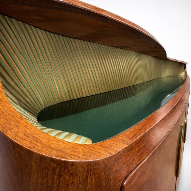 Italian 5-door sideboard with rounded and softened lines; the curved ends and streamlined yet voluminous overall shape,...