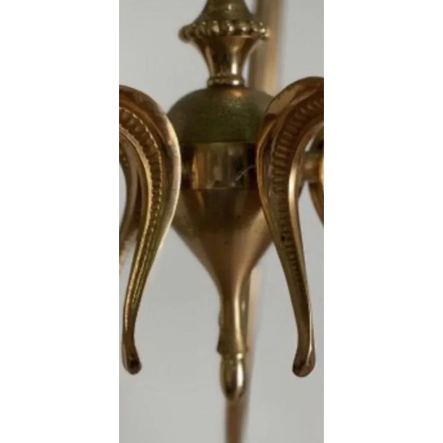 Nine Lights Chandelier attributed to Guglielmo Ulrich, in Very Good conditions. Designed 1950 to 1959 This piece is...