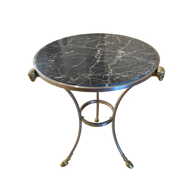 A glamorous vintage Parisian Maison Jansen style side table with polished gray-black and white veined marble top. This...