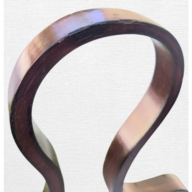 Elevate your dressing area or entryway with this striking Postmodern valet stand. Boasting a highly stylized,...