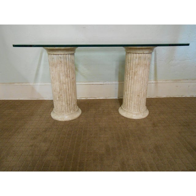 A Maitland Smith Tessallated Stone greek column desk that is 25 years old and was made in America. High quality pair of...