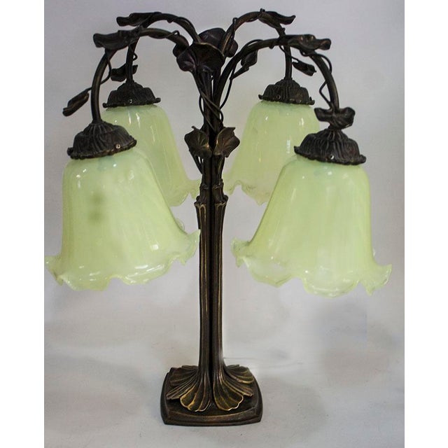 Stunning bronze style ornate lamp base supports 4 ruffled glass shades made by the Vianne Glass Co. This wonderful glass...