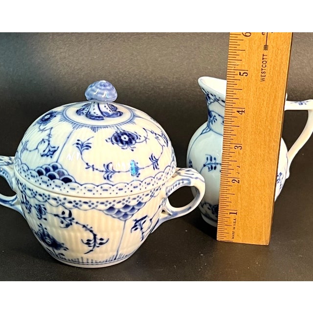 Elevate your tea or coffee service with the timeless elegance of the Blue Fluted Half Lace Sugar Pot and Creamer Set by...