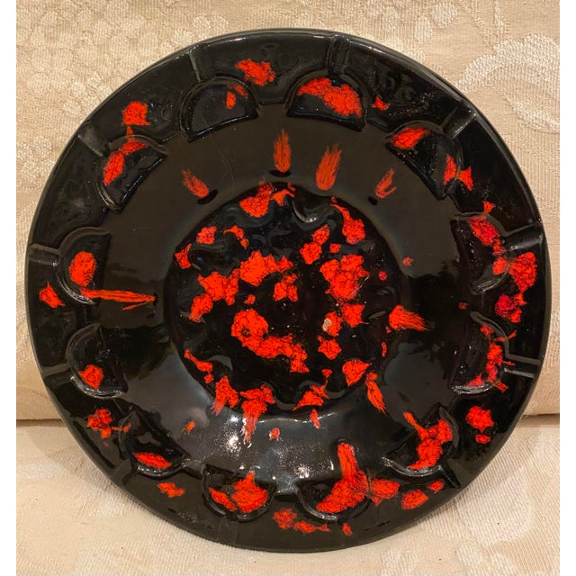 The best mid Century decor bowl or ashtray, absolutely stunning. Hand made ceramic with red splattered paint on black,...