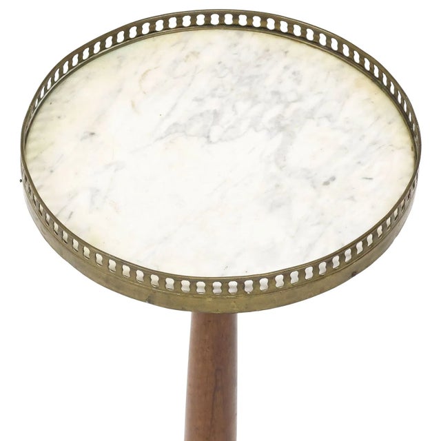 Elegant French Louis XVI–style guéridon or side table from the late 19th century. Features a circular inset marble top...