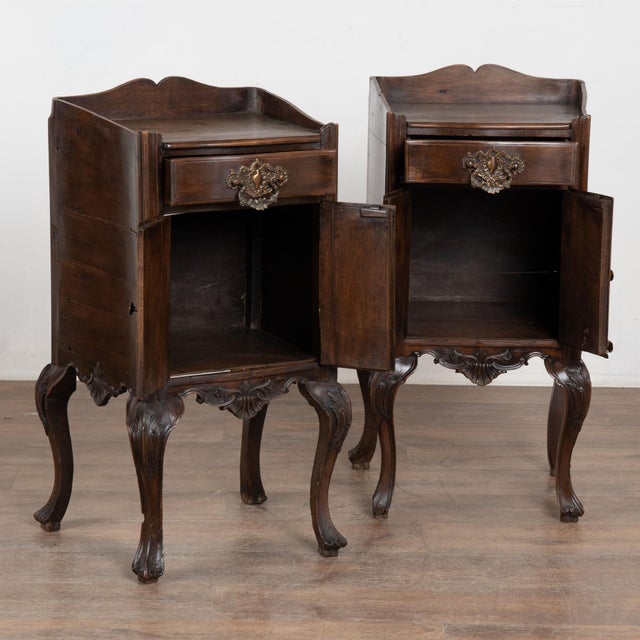 Pair of early 20th century Portuguese small cabinets or nightstands crafted in walnut. Each piece features a single upper...