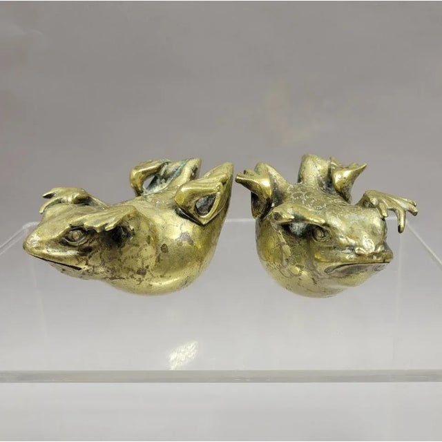 Circa 1900, solid bronze Chinese staff terminal formed as a dynamic toad. This toad would have been mounted at the top of...