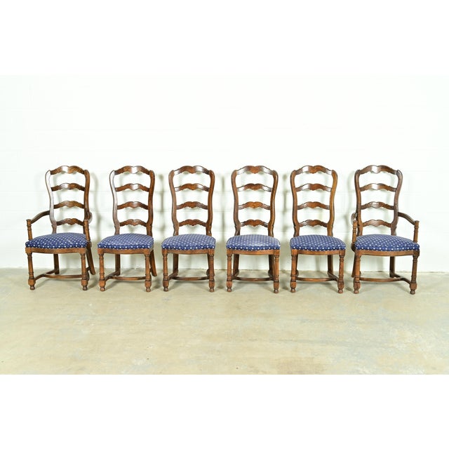 A gorgeous set of six French Country, French Provincial, or William and Mary style ladder back dining chairs By Century...