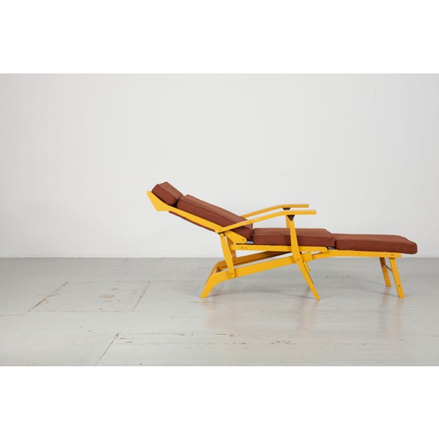 Folding yellow lacquered deckchair/lounger from 1950s Italy. The cushion is new and upholstered in fabric by Ludvig...