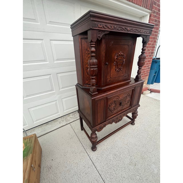 Here we have a Stunning Antique Jacobean Revival Hand Carved Hutch. No markings on piece. But most likely produced in...