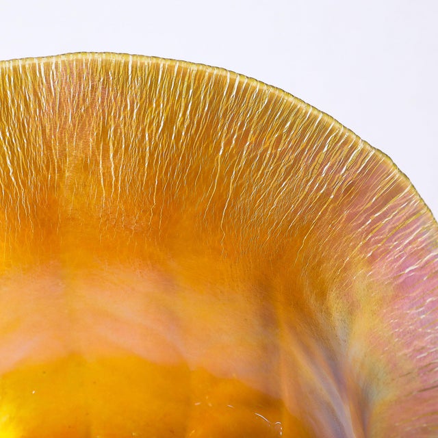 This stunning Art Nouveau iridescent Favrile glass bowl, signed L.C. Tiffany & Co. #1925, circa 1900, is a captivating...