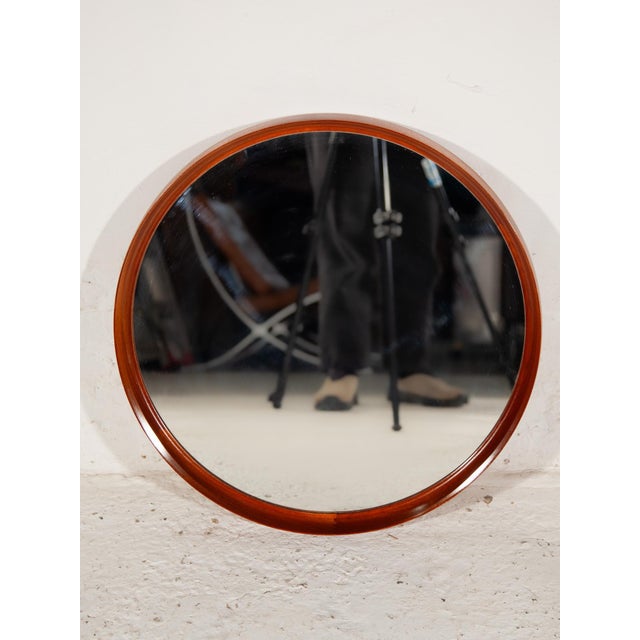 Swedish run wall hanging mirror by Uno & Östen Kristiansson for Luxus in teak hand crafted. The mirror is in excellent...