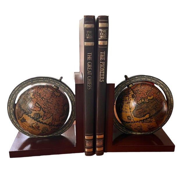 This is a pair of Mid-Century Italian "Old World" spinning globe bookends. They feature classic 16th-century style...