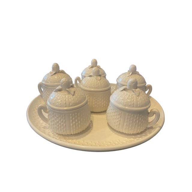 Mottahedeh Pots de Crème from the 1970s resting upon matching round platter. Fifteen pieces, each beautifully crafted in...