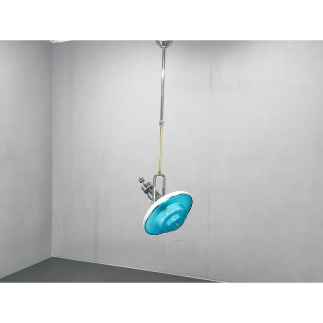 A rare and highly collectible adjustable ceiling light designed by otto mueller and produced by sistrach licht gmbh in...