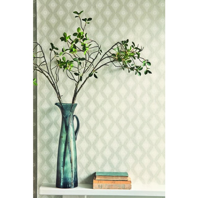 This lovely hand drawn trellis and daisy wallpaper has country house style at its heart. Surface printed to retain a...