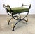 This elegant vintage vanity stool featuring a black iron curule X-frame accented with gleaming brass swan-head finials,...