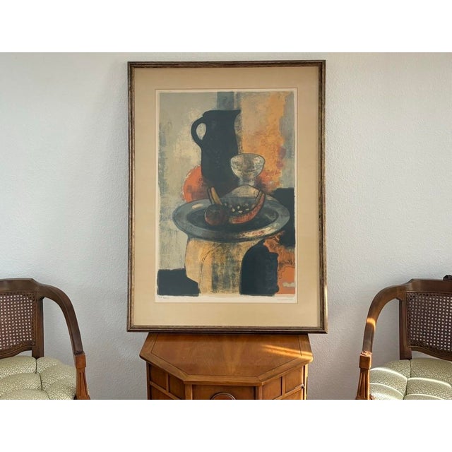 A striking mid-century abstract still life featuring sculptural vessels and fruit rendered in layered earth tones of...