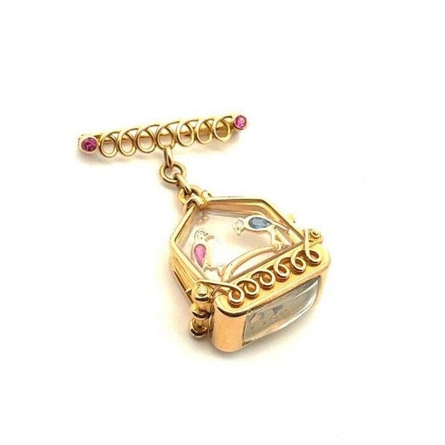 This unique and interesting watch fob brooch is crafted from 18k rose gold featuring a triple split frame bird cage with...