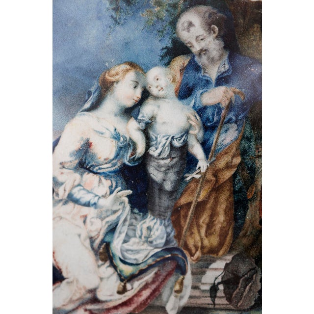This 17th-century parchment painting depicts the Holy Family with the Baby Jesus. Notice the expressive use of color with...