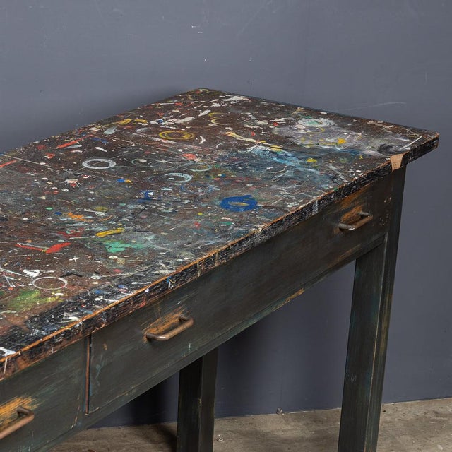 Vintage 20th Century table in solid beech, with a beautifully worn patina developed from years of use in a college art...