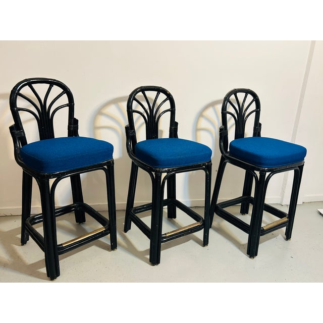 Vintage trio of black Rattan trio of counter bar stools perfect for next construction counter tops. They have newer and...