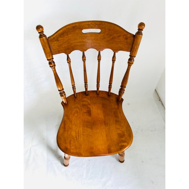 1970's Vintage Ethan Allen Heirloom Nutmeg Maple Colonial Spindle Back Dining H:34”. W:19” D:19”. Seat 17.5”. Arm 0. IW:...