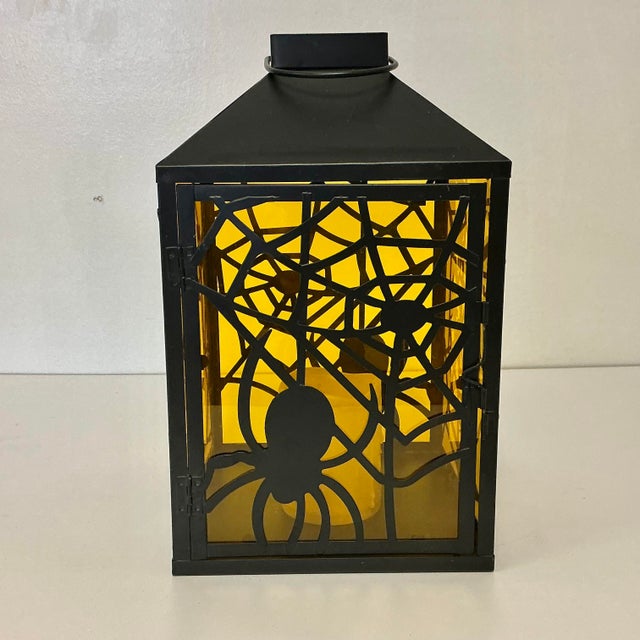 From our private collection we have a Halloween Spider Web Tole Metal Candleholder Lantern. The holiday home accent piece...